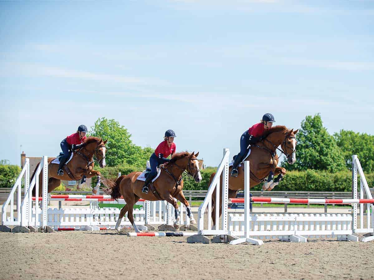 Tina Cook riding an oxer grid exercise