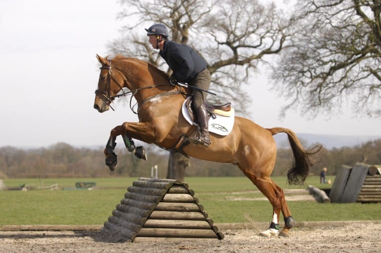 Oliver Townend jumping