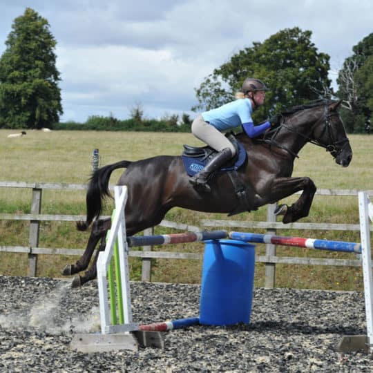 Izzy Taylor teaching rider how to jump XC corners