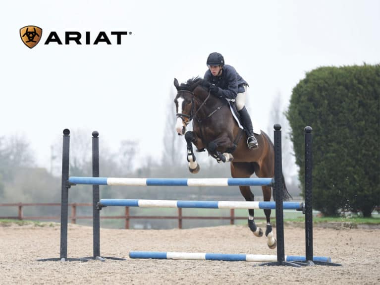 Nick Gauntlett jumping an oxer fence, with thanks to Ariat for their help