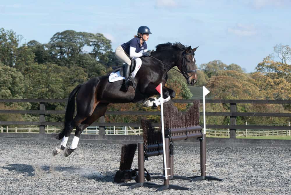 Ros Canter jumping a skinny fence