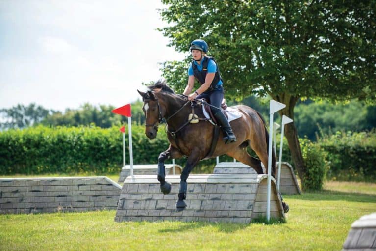 Horse and rider going cross-country