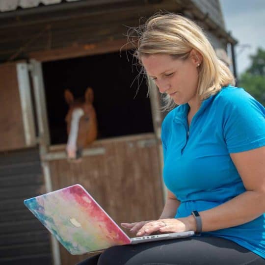 Horse rider using laptop